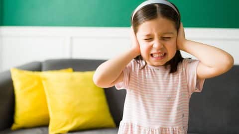 Sad kid listening to her parents fighting Sad kid listening to her parents fighting