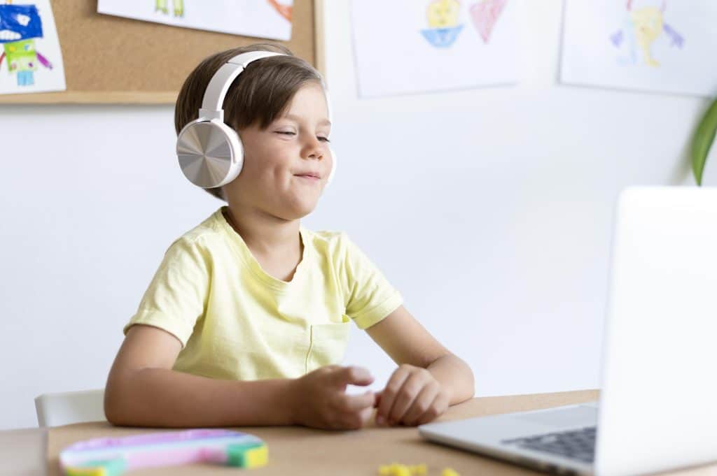 medium shot boy wearing headphones